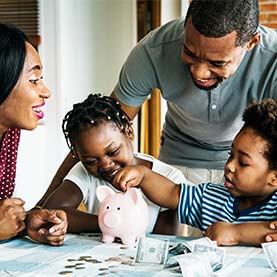 Family using piggy bank