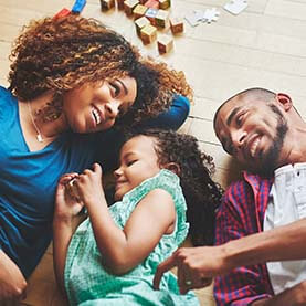 Family happy while laying on the floor